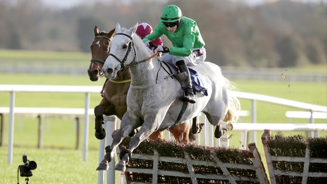 Pink Coat jumps the last hurdle in the Bar One Racing Handicap Hurdle at Fairyhouse