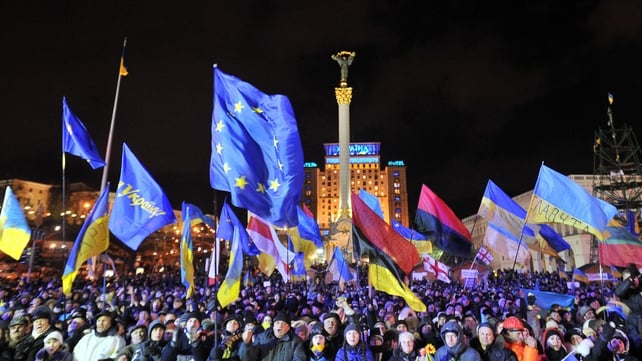 People shout slogans and wave Ukrainian and European Union flags during an opposition rally at Independence Square in Kiev People shout slogans and wave Ukrainian and European Union flags during an opposition rally at Independence Square in Kiev