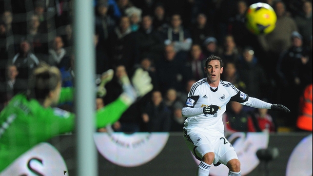 Swansea's Alvaro Vazquez watches his effort go wide of the post