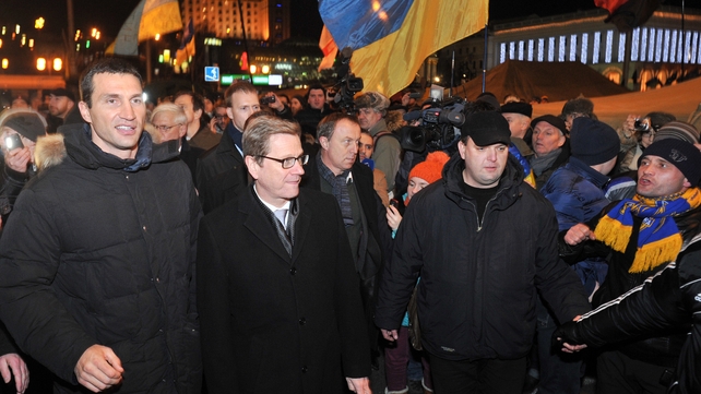 German Foreign Minister Guido Westerwelle (centre) visits anti-government protests in Kiev with Ukrainian boxing champion Wladimir Klitschko (L) German Foreign Minister Guido Westerwelle (centre) visits anti-government protests in Kiev with Ukrainian boxing champion Wladimir Klitschko (L)