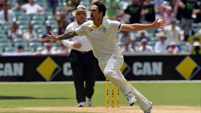 Mitchell Johnson celebrates his wicket of England's Stuart Broad