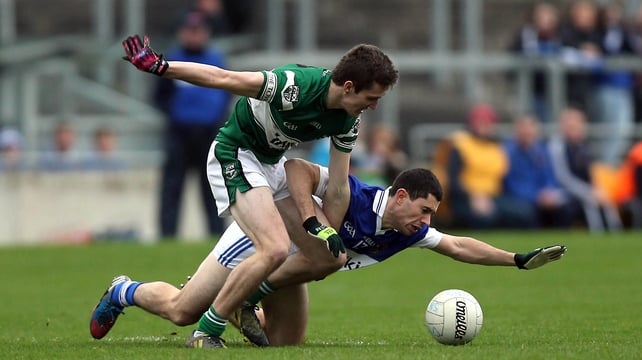 David Seale of Portlaoise (l) battles with Ruairi Trainor of St Vincent's