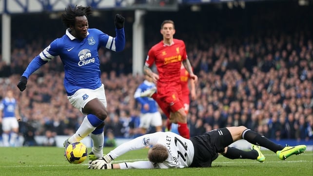 Simon Mignolet saves at the feet of Romelu Lukaku during the Merseyside derby