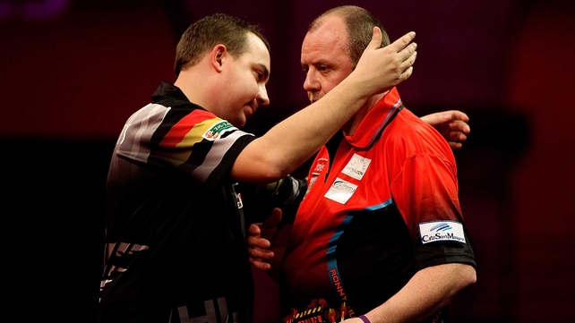 Kim Huybrechts (L) of Belgium embraces his brother Ronny Huybrechts of Belgium (R)