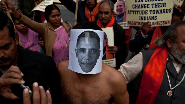 An activist wearing a mask depicting US President Barack Obama takes part in a protest near the US Embassy in New Delhi An activist wearing a mask depicting US President Barack Obama takes part in a protest near the US Embassy in New Delhi