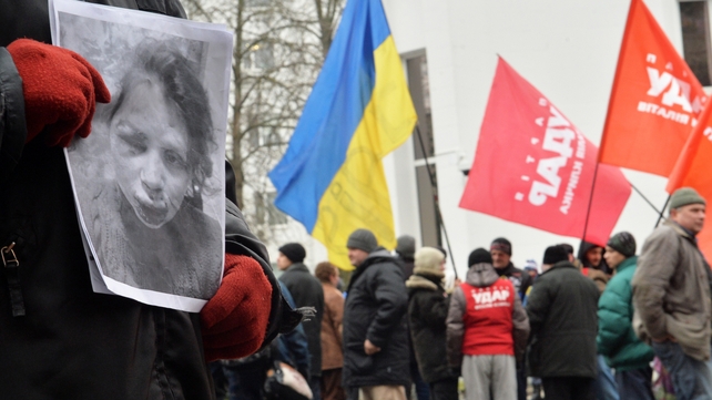 A protester holds a photo showing Tetyana Chornovil's injuries during a picket at the Internal Affairs Ministry in Kiev this morning A protester holds a photo showing Tetyana Chornovil's injuries during a picket at the Internal Affairs Ministry in Kiev this morning