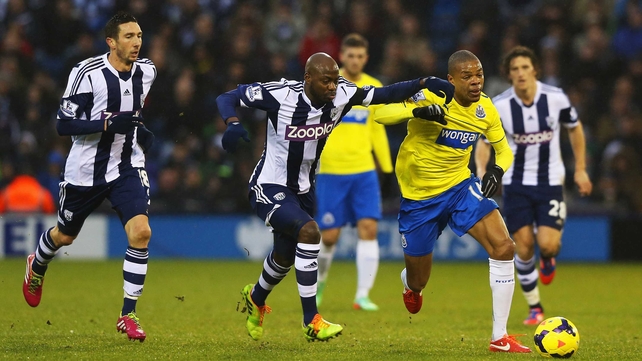 West Brom's Youssouf Mulumbu vies for possession with Newcastle's Loic Remy
