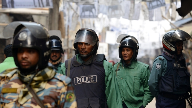 Bangladeshi riot police patrol a neighbourhood where several local polling stations are located in Dhaka Bangladeshi riot police patrol a neighbourhood where several local polling stations are located in Dhaka
