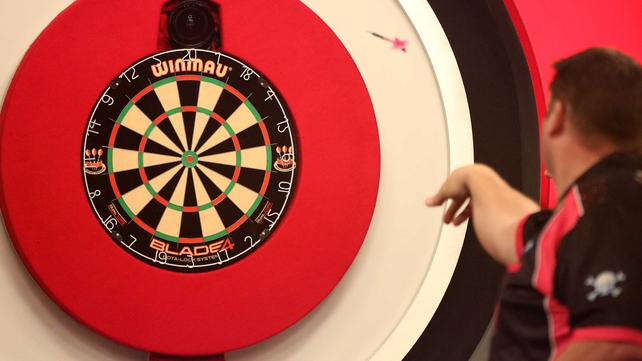 Scott Mitchell of England in action during his first round match against Paul Hogan