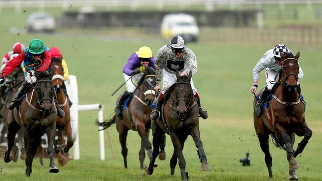 Mad Brian (centre) makes a quick resumption in a Novice Chase at Navan