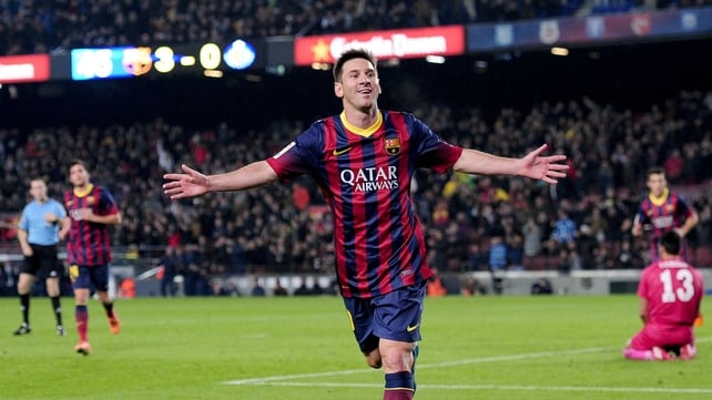 Lionel Messi celebrates scoring the first of his two goals at the Nou Camp