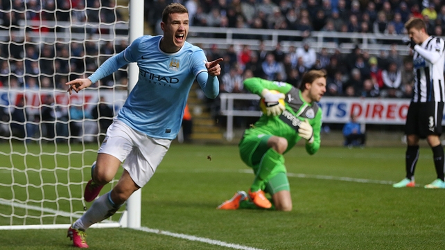 Edin Dzeko celebrates after giving Man City an early lead