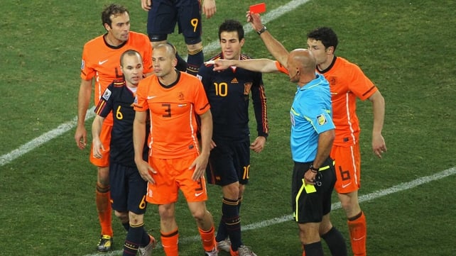 Howard Webb shows John Heitinga of the Netherlands a red card at the 2010 World Cup final