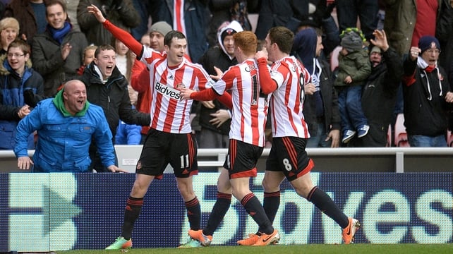 Adam Johnson (l) celebrates scoring Sundeland's equaliser with his team-mates