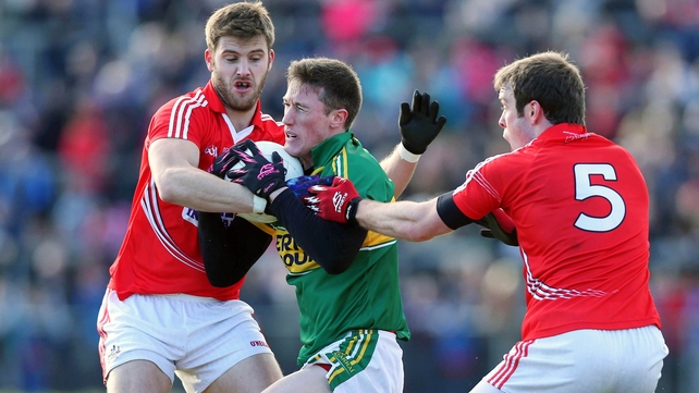 Jonathan Lynne of Kerry with Eoin Cadogan and James Loughrey of Cork