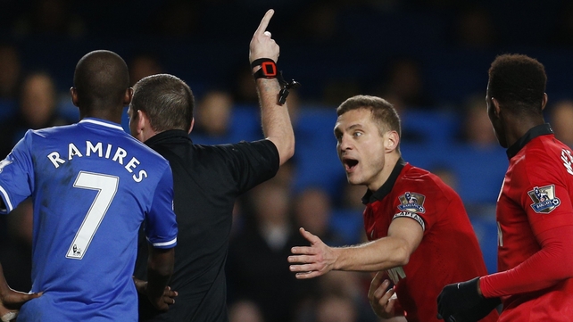 Nemanja Vidic getting his marching orders from referee Phil Dowd at Stamford Bridge