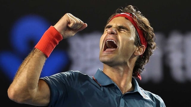 A euphoric Roger Federer punches the air after seeing off Andy Murray in four sets