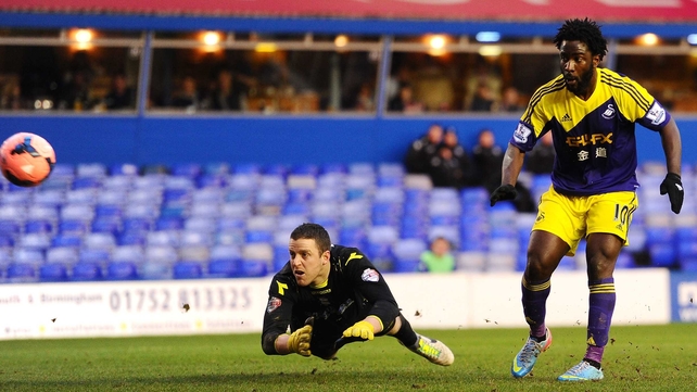 Wilfried Bony of Swansea scores his team's second goal past Birmingham goalkeeper Colin Doyle