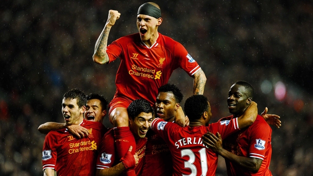 Liverpool celebrate after Daniel Sturridge scored their third goal
