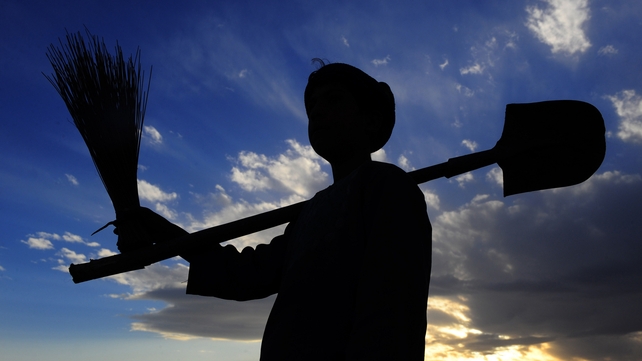 An Afghan farmer walks at sunset in Herat An Afghan farmer walks at sunset in Herat