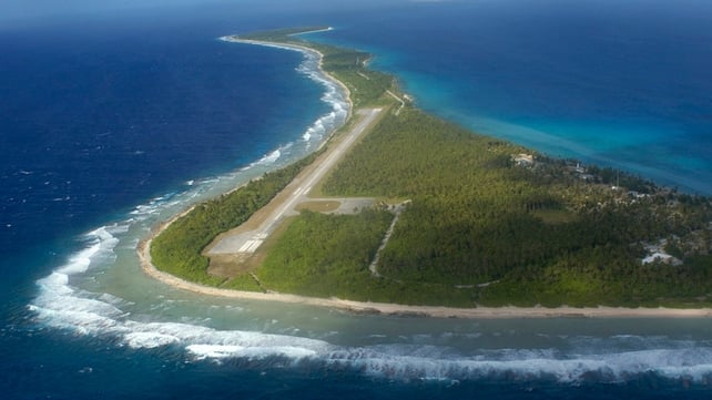 This undated aerial photo shows Rongelap Island, one of more than 60 in a necklace of coral islands This undated aerial photo shows Rongelap Island, one of more than 60 in a necklace of coral islands