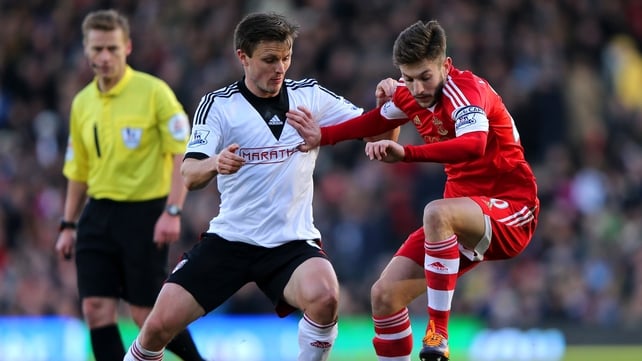 William Kvist of Fulham in action against Adam Lallana of Southampton