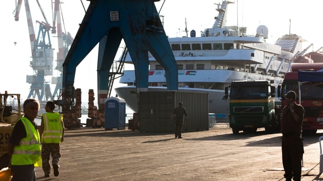 Israeli soldiers and port workers stand next to the Mavi Marmara, at Ashdod Port Israeli soldiers and port workers stand next to the Mavi Marmara, at Ashdod Port