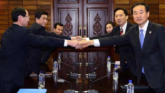 Delegations from North and South Korea shake hands over the reunion agreement Delegations from North and South Korea shake hands over the reunion agreement