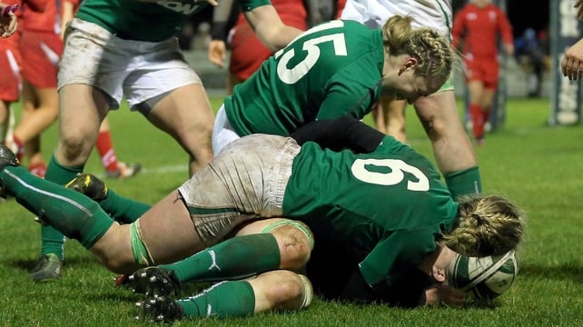 Heather O'Brien of Ireland is mobbed by team-mates after scoring