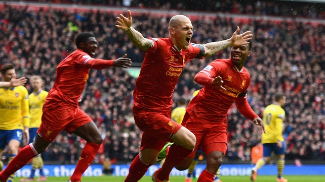 Martin Skrtel celebrates scoring the opening goal