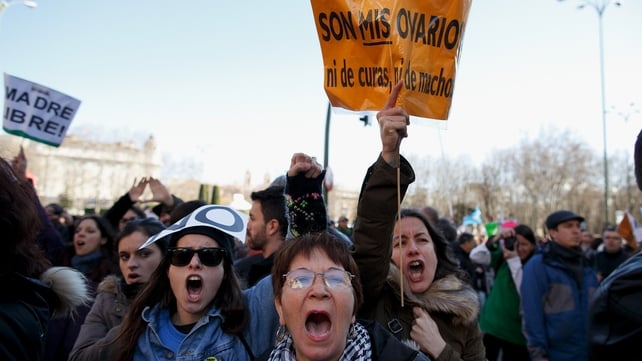 Protesters shout slogans and hold a placard reading 'they are my ovaries, nor of priest, nor of males' during a pro-choice protest in Madrid Protesters shout slogans and hold a placard reading 'they are my ovaries, nor of priest, nor of males' during a pro-choice protest in Madrid