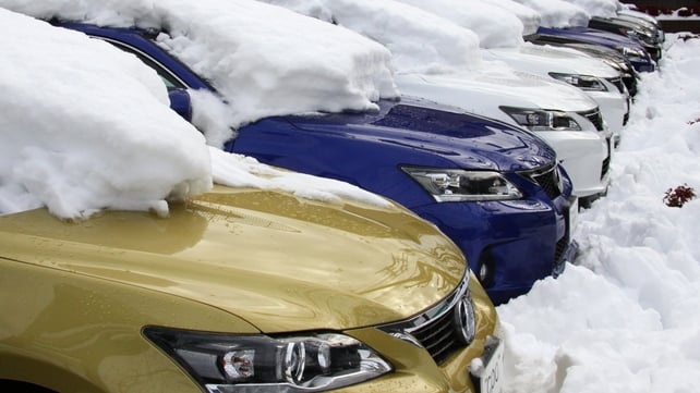 Lexus vehicles are covered with snow at a vehicle shop in Tokyo Lexus vehicles are covered with snow at a vehicle shop in Tokyo