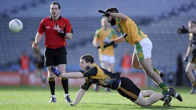 Fuerty's Philip Neilan (black and yellow) and Aidan Casey of Two Mile House