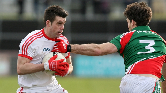 Darren McCurry of Tyrone and Ger Cafferkey of Mayo