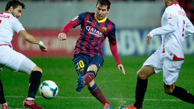 Lionel Messi's double helped Barcelona to a 4-1 win in rainy Seville