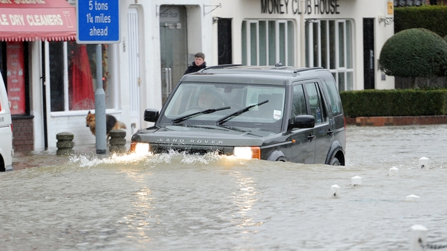 A car drives through flood waters in the village of Datchet in Berkshire (Pic: EPA) A car drives through flood waters in the village of Datchet in Berkshire (Pic: EPA)