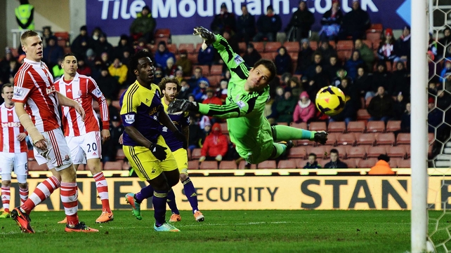 Asmir Begovic is unable to stop Chico Flores' effort
