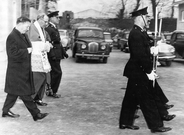 Minister for Justice Charles Haughey, Bishop Morris and Commissioner Daniel Costigan escorted by a recruit guard of honour (Pic: Brendan Treacy)