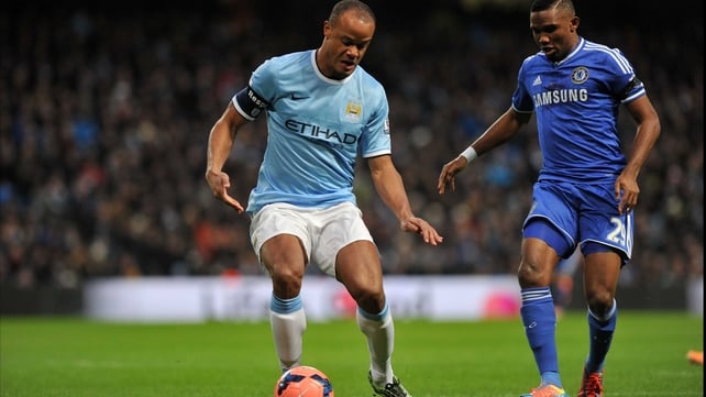 Manchester City's Vincent Kompany competes with Chelsea's Samuel Eto'o