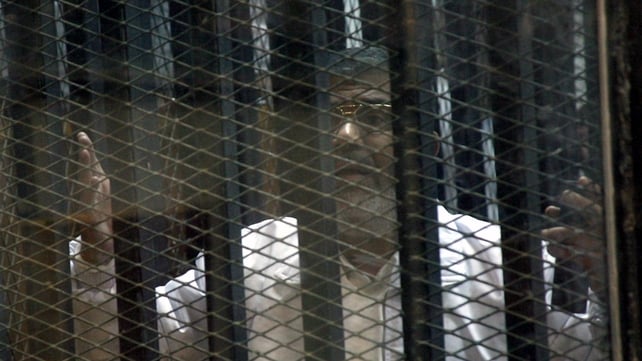 Mr Mursi's legal team protested they could not hear their client speak from inside a soundproof glass cage Mr Mursi's legal team protested they could not hear their client speak from inside a soundproof glass cage