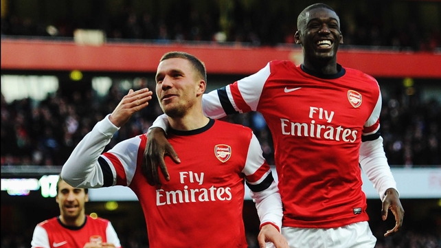 Lukas Podolski (L) scored Arsenal's winner against Liverpool