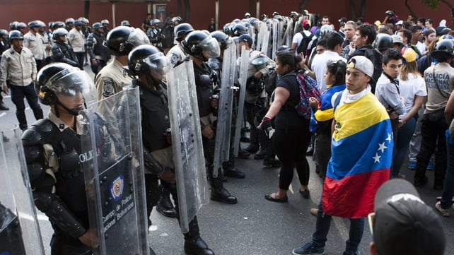 Riot police and protesters in Tachira.