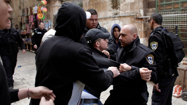 Palestinian men scuffle with Israeli police at an alleyway leading to the al-Aqsa Mosque compound Palestinian men scuffle with Israeli police at an alleyway leading to the al-Aqsa Mosque compound