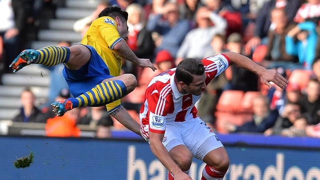 Arsenal's Olivier Giroud is tackled by Stoke's Erik Pieters