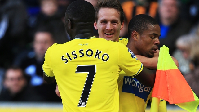 Loic Remy is congratulated by Moussa Sissoko (l) and Luuk de Jong (c) after scoring Newcastle's second goal
