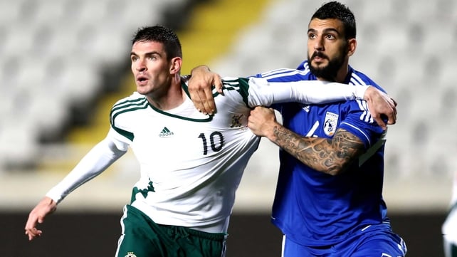 Cyprus' Giorgos Merkis battles with Northern Ireland's Kyle Lafferty