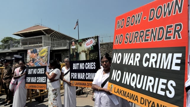 Pro-government activists marched towards US Embassy in Colombo where they shouted slogans against proposed war crimes investigation (Pic: EPA) Pro-government activists marched towards US Embassy in Colombo where they shouted slogans against proposed war crimes investigation (Pic: EPA)