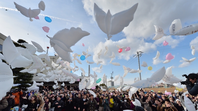 Balloons in the shape of doves are released into the air during a memorial service for tsunami victims at the former Yuriage junior high school in Natori, Miyagi Prefecture Balloons in the shape of doves are released into the air during a memorial service for tsunami victims at the former Yuriage junior high school in Natori, Miyagi Prefecture