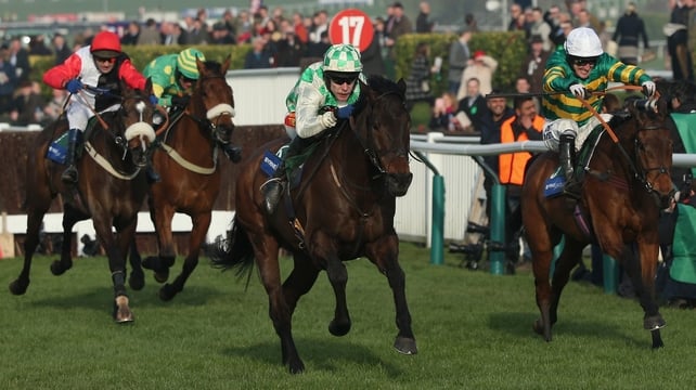 Tom Scudamore on Ballynagour (c) pulls away on the home straight from Tony McCoy on Colour Squadron (r)