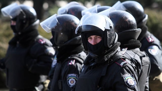 Police officers stand guard in front of the regional state administration building in Donetsk earlier this week Police officers stand guard in front of the regional state administration building in Donetsk earlier this week
